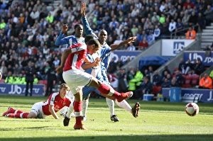 Images Dated 11th April 2009: Theo Walcott scores Arsenals 1st goal as Emerson Boyce