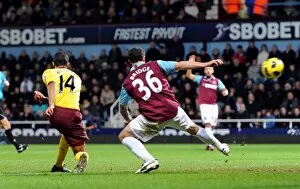 West Ham United v Arsenal 2010-11 Collection: Theo Walcott scores Arsenals 2nd goal under pressure from Wayne Bridge (West Ham)