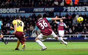 West Ham United V Arsenal 2010-11 Prints: Theo Walcott scores Arsenals 2nd goal under pressure from Wayne Bridge (West Ham)