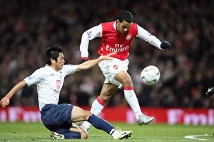 Arsenal v Tottenham- Carling Cup 2007-8 Gallery: Theo Walcott scores Arsenals goal under pressure from Lee Young-Pyo (Tottenham)