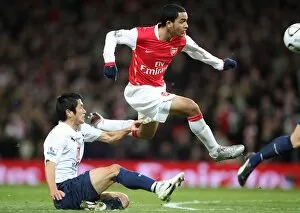 Images Dated 9th January 2008: Theo Walcott scores Arsenals goal under pressure from Lee Young-Pyo (Tottenham)