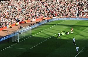 Images Dated 25th February 2012: Theo Walcott Scores Historic First Arsenal Goal Against Rival Tottenham (2012)