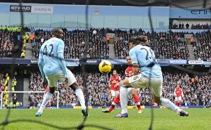 Manchester City Collection: Theo Walcott Scores Against Manchester City: A Premier League Rivalry (Manchester City vs Arsenal)