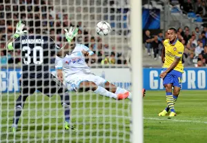 Marseille V Arsenal 2013-14 Prints: Theo Walcott Scores Against Mandanda: Arsenal Triumphs Over Marseille in Champions League Clash