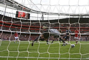 Images Dated 4th October 2009: Theo Walcott shoots past Blackburn goalkeeper Paul
