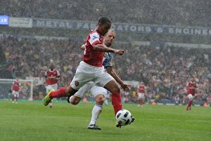 Images Dated 28th August 2010: Theo Walcott shoots past Blackburn goalkeeper Paul Robinson to score the 1st Arsenal goal