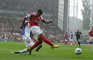 Images Dated 28th August 2010: Theo Walcott shoots past Blackburn goalkeeper Paul Robinson to score the 1st Arsenal goal