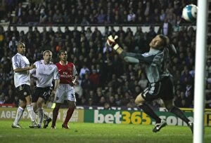 Derby County v Arsenal 2007-8 Collection: Theo Walcott shoots past Derby goalkeeper Roy Carroll to score the 4th Arsenal goal