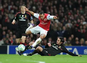 Arsenal V AC Milan 2011-12 Prints: Theo Walcott vs Alberto Aquilani: Intense Battle in Arsenal FC vs AC Milan UEFA Champions League Clash