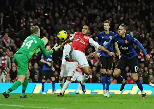Arsenal V Manchester United 2011-12 Prints: Theo Walcott vs. Anders Lindegaard: Intense Battle at the Emirates - Arsenal vs