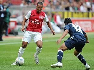 Cologne v Arsenal Collection: Theo Walcott vs Andrezinho: Clash in Pre-Season Friendly between Cologne and Arsenal