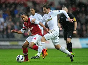 Swansea City V Arsenal 2012-13 Prints: Theo Walcott vs. Angel Rangel: Intense Battle in Swansea City vs