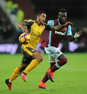 West Ham United V Arsenal 2016-17 Prints: Theo Walcott vs. Arthur Masuaku: A Strategic Battle in the Arsenal vs
