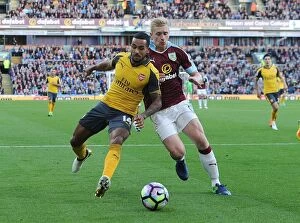 Images Dated 2nd October 2016: Theo Walcott vs Ben Mee: A Premier League Showdown at Burnley's Turf Moor (2016-17)