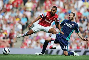 Arsenal V Sunderland 2012-13 Prints: Theo Walcott vs Carlos Cuellar: Intense Battle at Arsenal v Sunderland (2012-13)