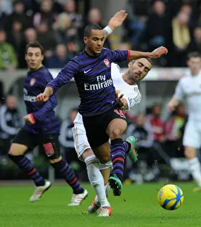 Swansea V Arsenal - FA Cup 3rd Rd 2012-13 Prints: Theo Walcott vs Chico Flores: FA Cup Clash Between Swansea and Arsenal