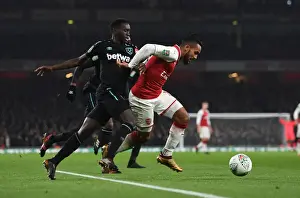 Arsenal V West Ham United - Carabao Cup 2017-18 Prints: Theo Walcott vs. Domingos Quina: A Battle of Skills in Arsenal's Carabao Cup Clash