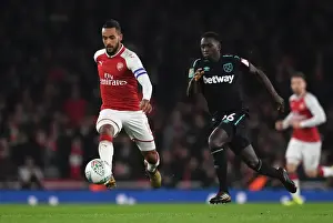 Arsenal V West Ham United - Carabao Cup 2017-18 Prints: Theo Walcott vs. Domingos Quina: A Carabao Cup Battle at Emirates Stadium
