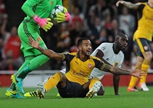 Arsenal v FC Basel 2016-17 Collection: Theo Walcott vs. Eder Balanta: A Controversial Penalty Call in Arsenal's UEFA Champions League