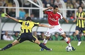 Images Dated 21st October 2008: Theo Walcott vs. Edu: Unforgettable Clash in Fenerbahce's 2-5 Victory over Arsenal in UEFA
