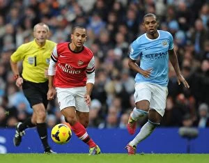 Manchester City v Arsenal 2013-14 Collection: Theo Walcott vs Fernandinho: Battle at the Etihad - Manchester City vs Arsenal (2013-14)
