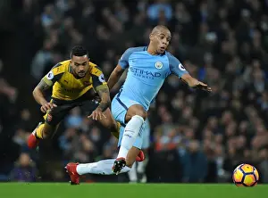 Manchester City V Arsenal 2016-17 Prints: Theo Walcott vs. Fernando: Intense Battle at the Etihad - Manchester City vs