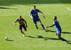 Leicester City V Arsenal 2015/16 Prints: Theo Walcott vs. Huth and Morgan: A Tactical Battle in the Leicester-Arsenal Premier League Clash (2015/16)