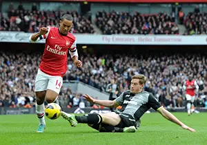 Arsenal V Tottenham Hotspur 2012-13 Prints: Theo Walcott vs Jan Vertonghen: A Fierce Encounter in the Arsenal-Tottenham Rivalry