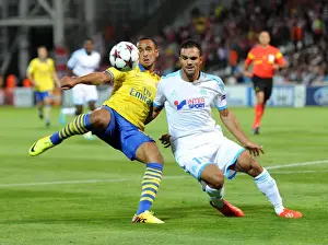 Marseille V Arsenal 2013-14 Prints: Theo Walcott vs. Jeremy Morel: A Tense Moment in the Marseille vs