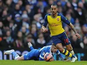 Brighton And Hove Albion V Arsenal - FA Cup 2014/15 Prints: Theo Walcott vs Joe Bennett: FA Cup Clash Between Brighton & Hove Albion and Arsenal