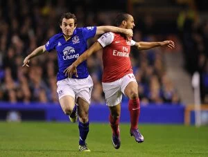 Everton v Arsenal 2011-12 Collection: Theo Walcott vs Leighton Baines: A Premier League Rivalry Ignites at Goodison Park (2011-12)