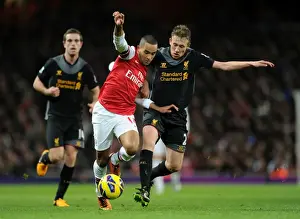 Arsenal V Liverpool 2012-13 Prints: Theo Walcott vs. Lucas Leiva: Intense Battle at Arsenal v Liverpool
