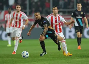 Olympiacos V Arsenal 2015-16 Prints: Theo Walcott vs. Luka Milivojevic: A Battle in the UEFA Champions League