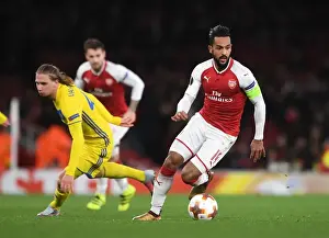 Arsenal V BATE Borisov 2017-18 Prints: Theo Walcott vs Maksim Volodko: A Fierce Face-Off in Arsenal FC's UEFA Europa League Battle against BATE Borisov