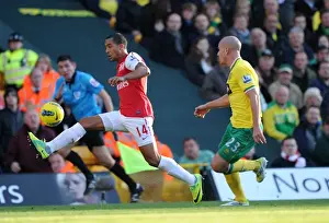 Theo Walcott vs Marc Tierney: A Premier League Battle at Carrow Road, November 2011