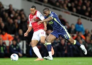 Images Dated 16th April 2012: Theo Walcott vs. Maynor Figueroa: A Fight for Control at Emirates Stadium - Arsenal vs