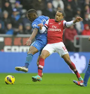 Wigan Athletic V Arsenal 2012-13 Prints: Theo Walcott vs. Maynor Figueroa: Battle at DW Stadium - Wigan Athletic vs