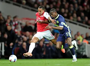 Arsenal V Wigan Athletic 2011-12 Prints: Theo Walcott vs. Maynor Figueroa: Battle at Emirates Stadium - Arsenal v Wigan Athletic