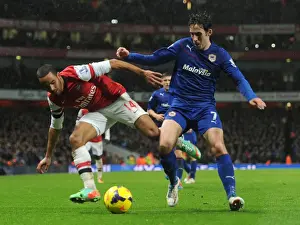 Arsenal V Cardiff City 2013-14 Prints: Theo Walcott vs. Peter Whittingham: Intense Battle at the Emirates - Arsenal v Cardiff City