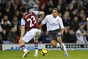 Burnley v Arsenal 2009-10 Collection: Theo Walcott vs. Stephen Jordan: A Draw at Burnley's Turf Moor in the Barclays Premier League