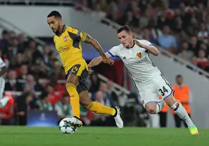 Arsenal V FC Basel 2016-17 Prints: Theo Walcott vs. Taulant Xhaka: A Battle at the Emirates - Arsenal FC vs