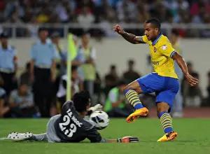 Vietnam V Arsenal 2013-14 Prints: Theo Walcott vs Tran Buu Ngoc: Vietnam Stands Strong Against Arsenal
