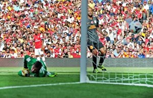 Images Dated 4th August 2013: Theo Walcott watches his cross go in for Arsenals goal. Arsenal 1: 2 Galatasaray