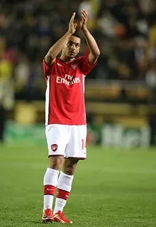 Theo Walcott waves to the Arsenal fans after the match