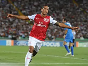 Theo Walcott's Brace: Arsenal Secures UEFA Champions League Progress vs. Udinese