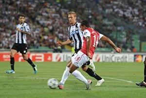 Images Dated 24th August 2011: Theo Walcott's Brace: Arsenal's UEFA Champions League Victory over Udinese Calcio (2011)