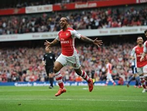Arsenal v West Bromwich Albion 2014/15 Collection: Theo Walcott's Brace: Arsenal's Winning Moment Against West Bromwich Albion (2014/15)