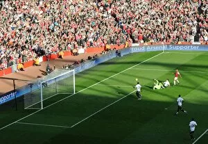 Images Dated 25th February 2012: Theo Walcott's Historic Rivalry-Defying Goal: Arsenal vs. Tottenham (2012)