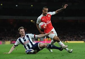 Arsenal v West Bromwich Albion 2015-16 Collection: Theo Walcott's Intense Chase Down of Jonny Evans: A Thrilling Moment from Arsenal vs