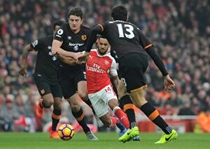 Images Dated 11th February 2017: Theo Walcott's Intense Showdown Against Hull City's Defense in the Premier League